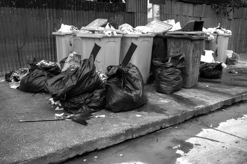 Workers wearing PPE during a large commercial waste collection in Farnborough