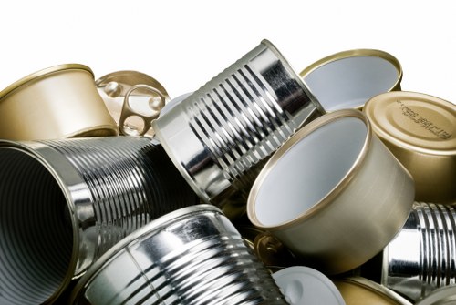Field staff inspecting waste containers at a commercial site